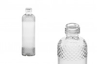 Bottle 330 ml transparent with embossed designs on the neck and base