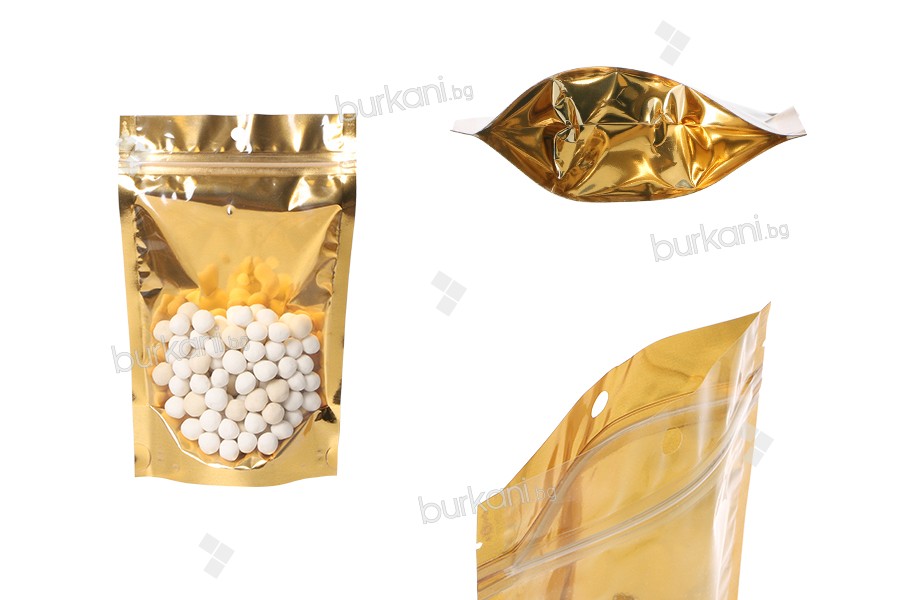Doy Pack tipi çantalar 130x40x205 mm   alüminyum arka yüzü altın sarısı, önü şeffaf fermuarlı ve ısıl yapıştırma ile kapatma özelliği - 100 adet