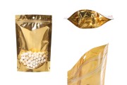 Doy Pack tipi çantalar 150x40x230 mm  alüminyum arka yüzü altın sarısı, önü şeffaf fermuarlı ve ısıl yapıştırma ile kapatma özelliği - 100 adet