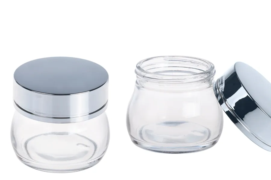 Стъклено луксозно бурканче за крем 100 мл със златиста или сребриста капачка-изображение_група