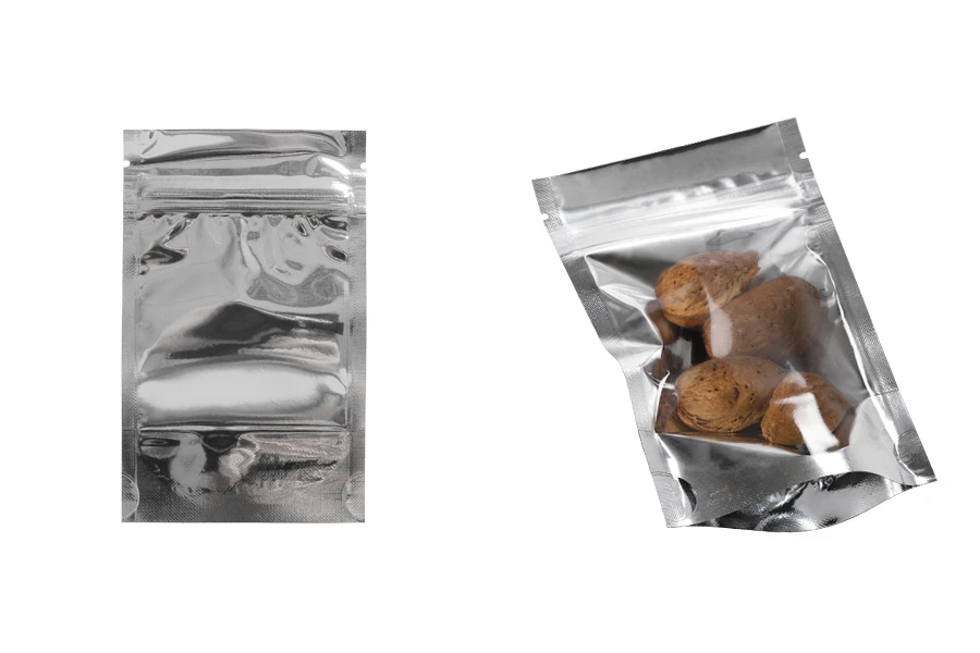 Опаковка тип  Doy Pack с размери  80х30х130 мм -  алуминиева задна част , прозрачна предна част с  цип и възможност за термозапечатване - 100 бр. Опаковка тип  Doy Pack с размери  80х30х130 мм -  алуминиева задна част , прозрачна предна част с  цип и възможност за термозапечатване - 100 бр.