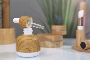 Стъклена бутилка 50 мл с капкомер с външна облицовка наподобяващо дърво-изображение_група