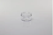 Прозрачно пластмасови бурканче 50 ml с бяла капачка със сребриста лента в опаковка от 12 броя Прозрачно пластмасови бурканче 50 ml с бяла капачка със сребриста лента в опаковка от 12 броя